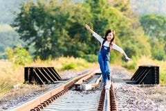 https://thumbs.dreamstime.com/t/girl-walk-railway-young-asian-thai-walking-forest-background-77423113.jpg