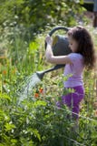 Girl Watering The Garden