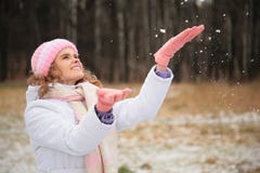 Girl in winter catches snowflakes stock image Girl in winter catches snowflakes stock image