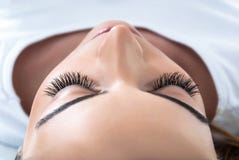 Girl With Extended Silk Eyelashes Lies In A Beauty Studio Stock Images