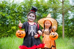 Girls In Halloween Costume Standing In Park Stock Photography