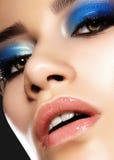 Glamour portrait of beautiful woman model with bright evening makeup with blue color and clean healthy skin face Stock Photos Glamour portrait of beautiful woman model with bright evening makeup with blue color and clean healthy skin face Stock Photos