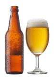Glass of beer with bottle