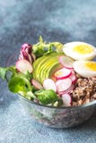 Bowl of wild rice with avocado, egg and lettuce stock photos Bowl of wild rice with avocado, egg and lettuce stock photos