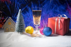 Glass of champagne with Christmas decoration. Traditional winter holiday alcohol drink in snow with creative New Year artwork. stock photos Glass of champagne with Christmas decoration. Traditional winter holiday alcohol drink in snow with creative New Year artwork. stock photos