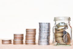 Glass of coin and four pole range of coins on vintage blurred ba royalty free stock photo Glass of coin and four pole range of coins on vintage blurred ba royalty free stock photo
