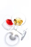 Glass glasses with drinks of different colors on a white background. Top view. The concept of an alcoholic cocktail royalty free stock images Glass glasses with drinks of different colors on a white background. Top view. The concept of an alcoholic cocktail royalty free stock images