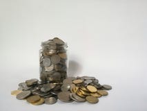 A glass jar full of coins royalty free stock photos A glass jar full of coins royalty free stock photos