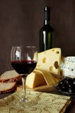 Glass Of Red Wine, Bottle And Several Varieties Of Cheese Stock Photography