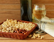Glass Of White Wine, Nuts And Linen Napkin Royalty Free Stock Photography
