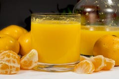 Glass of orange juice beside a jar and several fruits royalty free stock photos Glass of orange juice beside a jar and several fruits royalty free stock photos