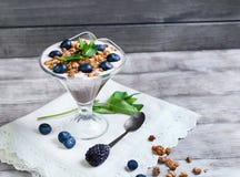 Glass vase decorated with berries and granola yogurt Royalty Free Stock Photo Glass vase decorated with berries and granola yogurt Royalty Free Stock Photo