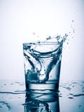 Glass of water splash royalty free stock photography Glass of water splash royalty free stock photography