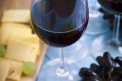 Glass of wine merlot, grapes board appetizer vintage creative celebration menu natural vintage card on a blue wooden background royalty free stock photo Glass of wine merlot, grapes board appetizer vintage creative celebration menu natural vintage card on a blue wooden background royalty free stock photo