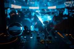 Glass With Martini With Olive Inside On Dj Controller In Night Club. Dj Console With Club Drink At Music Party In Nightclub With D Stock Photography