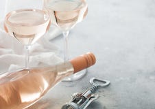 Glasses And Bottle Of Rose Pink Wine With Steel Corkscrew On Light Background Stock Image