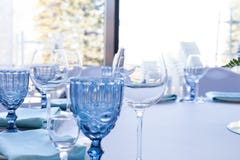 Glasses on the wedding table on a light background stock images Glasses on the wedding table on a light background stock images