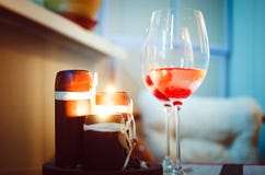 Glasses of wine and lighted candles. Romantic scenery. stock photo Glasses of wine and lighted candles. Romantic scenery. stock photo
