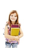 Glimlachend schoolmeisje met de boeken van de rugzakholding royalty-vrije stock foto Glimlachend schoolmeisje met de boeken van de rugzakholding royalty-vrije stock foto