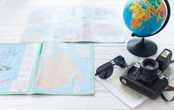 Globe and map on white background with camera. The concept of travel stock photos Globe and map on white background with camera. The concept of travel stock photos