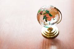 Globe on wooden table. Save Earth. model on wooden desk. wall empty space background stock image Globe on wooden table. Save Earth. model on wooden desk. wall empty space background stock image