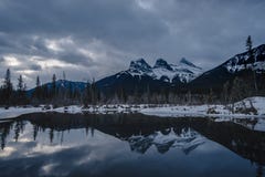 Gloomy day with the Three Sisters Reflecting on the Water stock images Gloomy day with the Three Sisters Reflecting on the Water stock images
