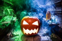 Glowing pumpkin for Halloween in witcher cottage royalty free stock image Glowing pumpkin for Halloween in witcher cottage royalty free stock image