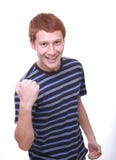 Glücklicher junger Mann, der gewinnende Geste tut lizenzfreies stockbild Glücklicher junger Mann, der gewinnende Geste tut lizenzfreies stockbild