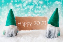 Gnomos de turquesa com cartão, 2017 feliz imagens de stock royalty free Gnomos de turquesa com cartão, 2017 feliz imagens de stock royalty free
