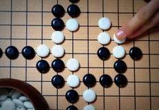 Go board game position - an ancient asian strategy game stock image Go board game position - an ancient asian strategy game stock image