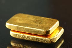 Gold bar put on the dark background. royalty free stock images Gold bar put on the dark background. royalty free stock images