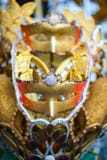 Gold carnival mask at a night carnival in Indonesia stock photo Gold carnival mask at a night carnival in Indonesia stock photo