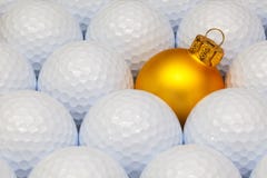 Gold Christmas decoration between the golf balls