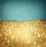 Gold glitter background and blue vintage torn paper . room for copy space.