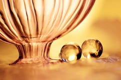 Gold Marbles And A Bottle Royalty Free Stock Photo
