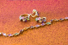 Gold ornaments studded with precious stones. The best gift for the beloved woman. royalty free stock photos Gold ornaments studded with precious stones. The best gift for the beloved woman. royalty free stock photos