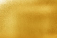Gold texture background for design. Shiny yellow metal or foil surface material