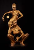 Gold Bodyart. Coloring. Golden Women Silhouettes with Retro Vinyl Records over black. Creative Art Concept