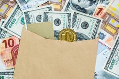 Golden Bitcoin Crypto currency coin in the envelope with dollar banknotes and credit card. Investments, cryptocurrency digital pay stock images Golden Bitcoin Crypto currency coin in the envelope with dollar banknotes and credit card. Investments, cryptocurrency digital pay stock images