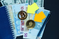Golden bitcoin with yellow paper arrows on blue background. Internet e- commerce, security, risk, investment, business concept royalty free stock images Golden bitcoin with yellow paper arrows on blue background. Internet e- commerce, security, risk, investment, business concept royalty free stock images