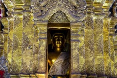 Golden Buddha image in golden pagoda with details of Thai art in a Buddhist temple in Thailand. royalty free stock photos Golden Buddha image in golden pagoda with details of Thai art in a Buddhist temple in Thailand. royalty free stock photos