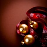 Golden christmas balls with red gift ribbon stock photography Golden christmas balls with red gift ribbon stock photography