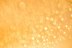 Golden defocused blurred background texture with bokeh stock photo Golden defocused blurred background texture with bokeh stock photo