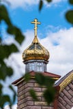 Golden domes and crosses of the orthodox church on a blue sky background stock photography Golden domes and crosses of the orthodox church on a blue sky background stock photography