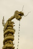 Golden dragon statue on high. royalty free stock image Golden dragon statue on high. royalty free stock image