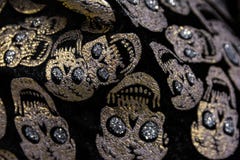 Golden Gem Skulls Rhinestones Fabric Texture Pattern Closeup Hal stock photo Golden Gem Skulls Rhinestones Fabric Texture Pattern Closeup Hal stock photo