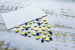 Golden hearts and small blue flowers in an envelope on a lilac background. Valentine`s Day. love concept Gift, message for lover stock images Golden hearts and small blue flowers in an envelope on a lilac background. Valentine`s Day. love concept Gift, message for lover stock images