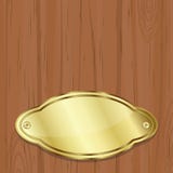 Golden Plate Over Wood Stock Image