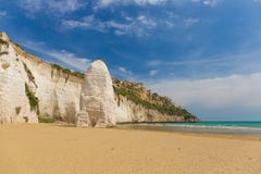 Golden Sand Beach Of Vieste With Pizzomunno Rock, Gargano Peninsula, Apulia, South Of Italy Royalty Free Stock Photo Golden Sand Beach Of Vieste With Pizzomunno Rock, Gargano Peninsula, Apulia, South Of Italy Royalty Free Stock Photo
