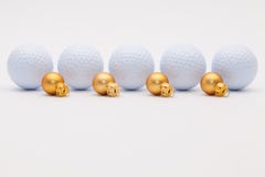Golf balls and golden Christmas decoration